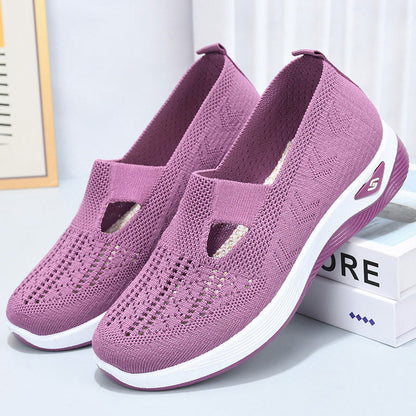 Scarpe da ginnastica viola in maglia traspirante, suola bianca antiscivolo, design slip-on, ideali per sport e tempo libero.