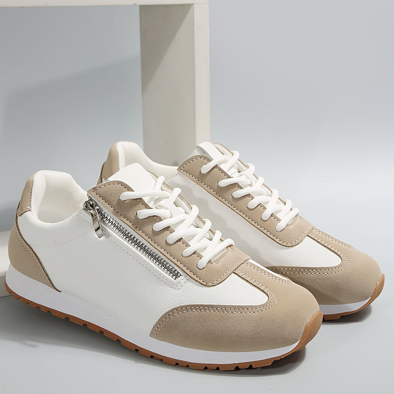 Scarpe da ginnastica bianche e beige con cerniera laterale, suola in gomma antiscivolo, design moderno, ideali per sport e tempo libero.