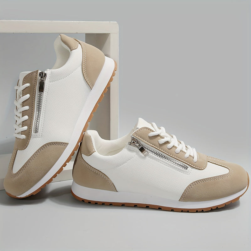 Scarpe da ginnastica bianche e beige con cerniera laterale, suola in gomma antiscivolo, design moderno. Scarpe sportive casual per uomo e donna.