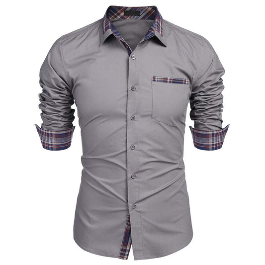 Camicia grigia da uomo con maniche lunghe arrotolate, dettagli a quadri su colletto e polsini, taschino frontale. Elegante e moderna.