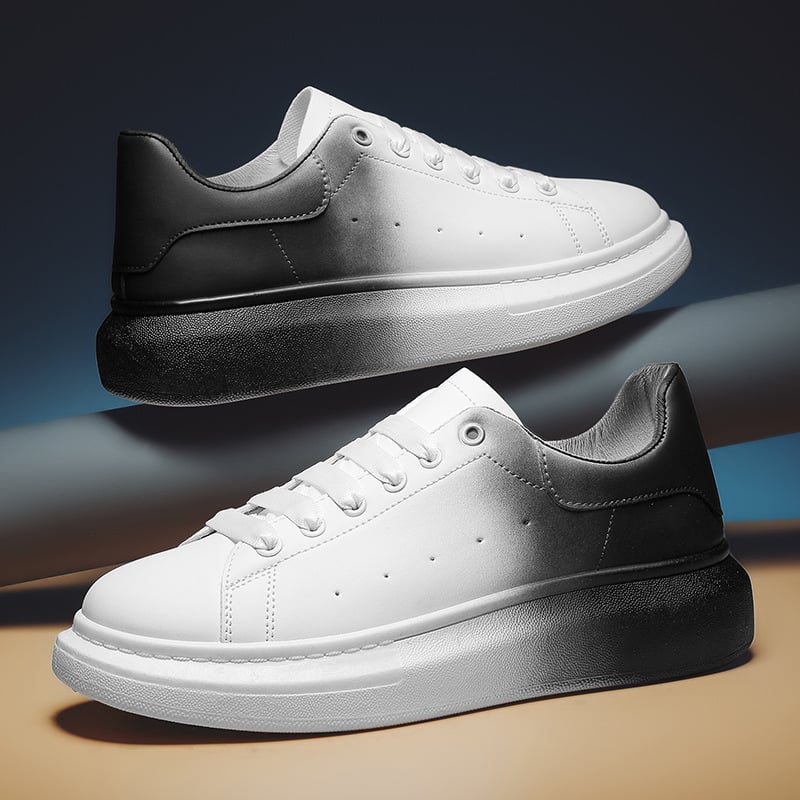 Scarpe da ginnastica bianche e nere sfumate, design moderno, suola spessa, stile casual, moda uomo e donna, tendenza calzature 2023.