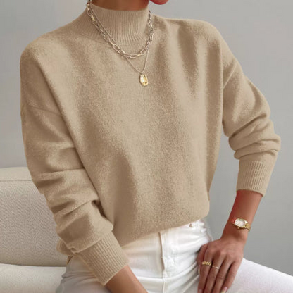 Women's cashmere turtleneck sweater with a straight fit and ribbed trims.