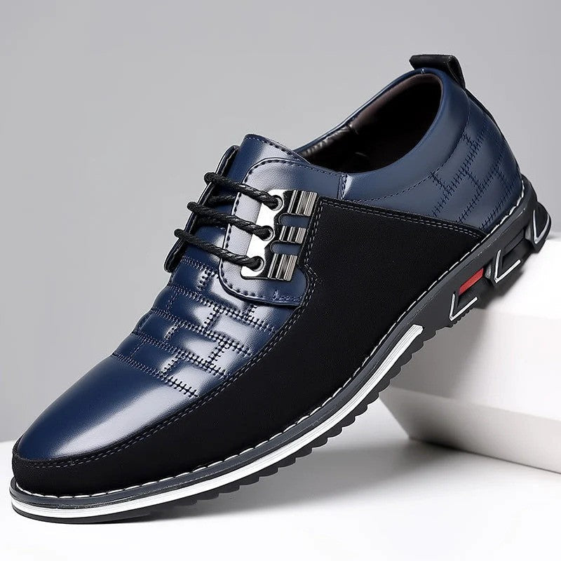 Scarpa da uomo elegante blu e nera, design moderno con lacci, suola antiscivolo. Ideale per moda maschile, calzature casual e formali.