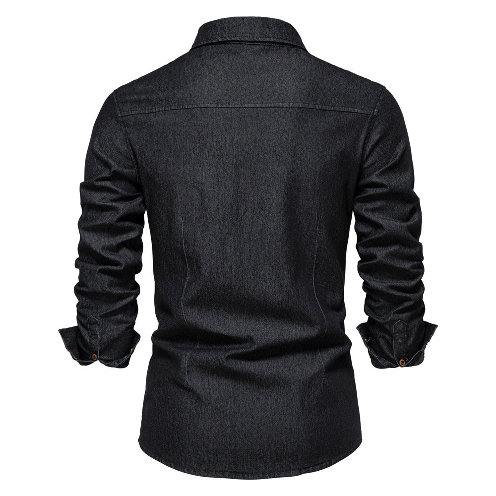 Men's solid-color denim shirt with textured fabric, chest pockets, and long sleeves.