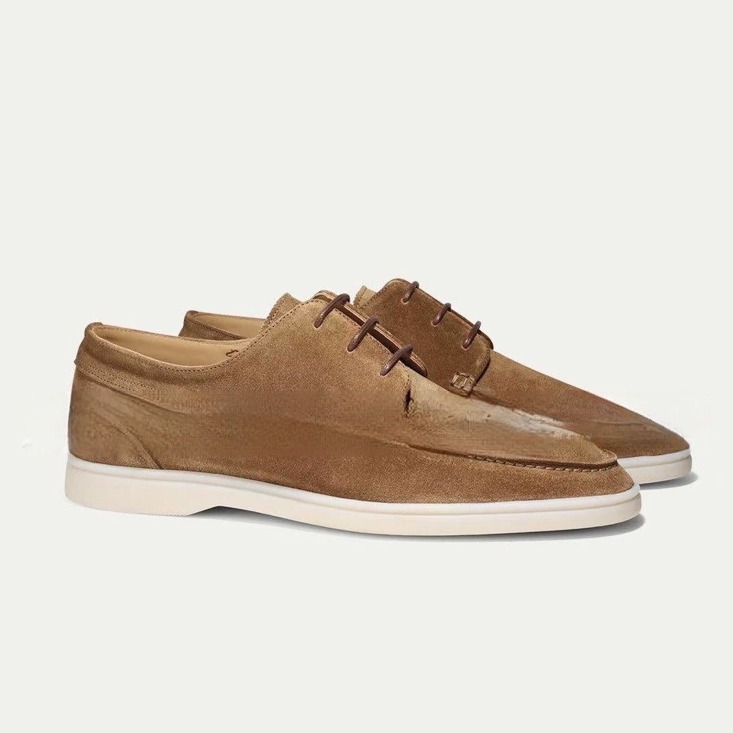 Men’s suede-style boat shoes with laces, moccasin stitching, and a thick contrasting sole.