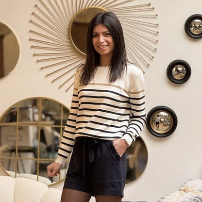 Women's striped knit sweater with a crew neck and shoulder buttons