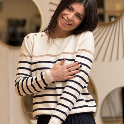 Women's striped knit sweater with a crew neck and shoulder buttons
