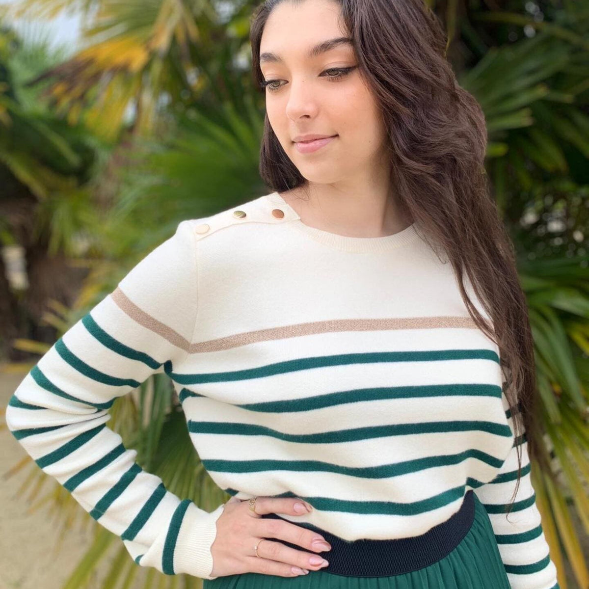 Women's striped knit sweater with a crew neck and shoulder buttons
