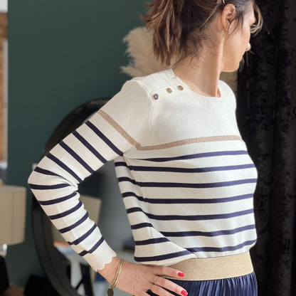 Women's striped knit sweater with a crew neck and shoulder buttons