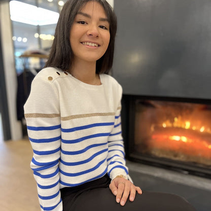 Women's striped knit sweater with a crew neck and shoulder buttons
