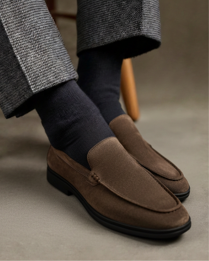 Men’s suede loafers with contrasting black soles and a slip-on design