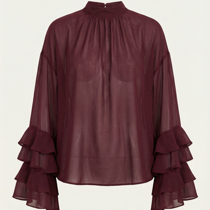 Blusa de mujer color burdeos de gasa transparente con mangas con volantes y cuello alto.