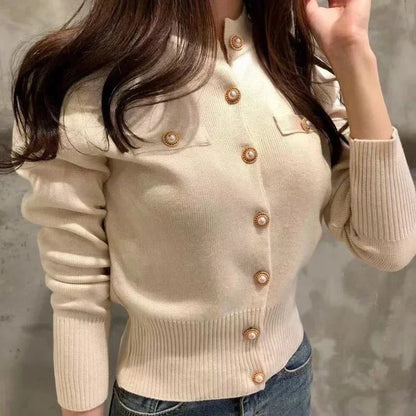 Women's fitted knit cardigan with a high collar, button closure, and long sleeves