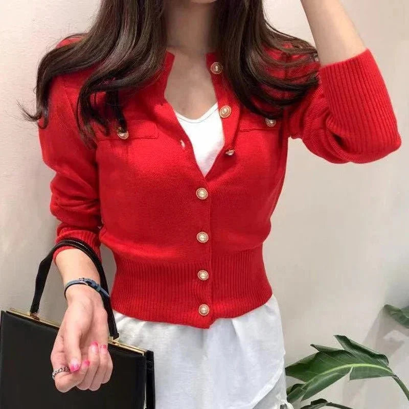 Women's fitted knit cardigan with a high collar, button closure, and long sleeves