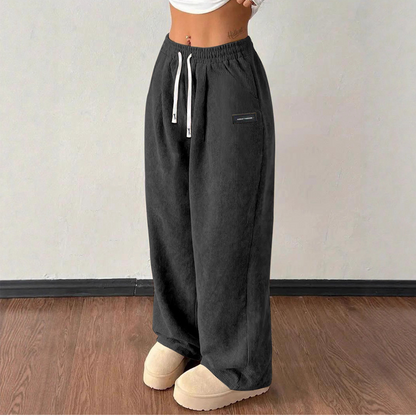 Women's Wide-Leg Corduroy Pants with an Elastic Waist, Drawstring, and Side Pockets.